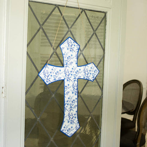 Blue and white cross door hanger on door